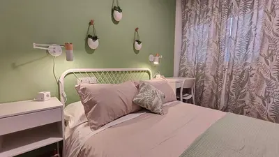 a bedroom with a bed with a white bed frame at O meo refuxio in Barreiros