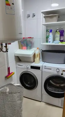 a kitchen with a washing machine and a sink at O meo refuxio in Barreiros