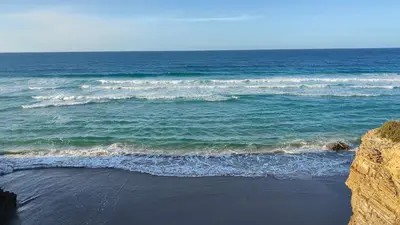 an aerial view of the ocean with waves at O meo refuxio in Barreiros