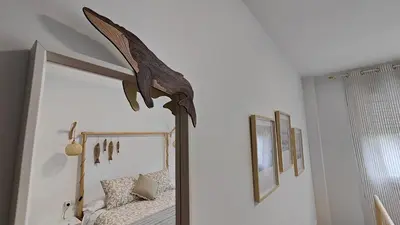 a bedroom with a bed with a large mirror at O meo refuxio in Barreiros