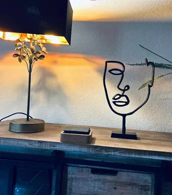 two lamps on top of a table with a wall at El balcón de la Penela in Belesar