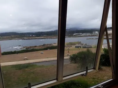 a view of a river from a window at EnSAN CIPRIÁN Faro de Punta Atalaya in Cervo