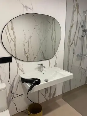a bathroom with a sink and a mirror on the wall at Pensión Casa Cancela in Palas de Rei