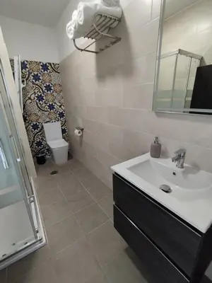 a bathroom with a sink and a toilet and a mirror at BALCON DEL EO in Ribadeo
