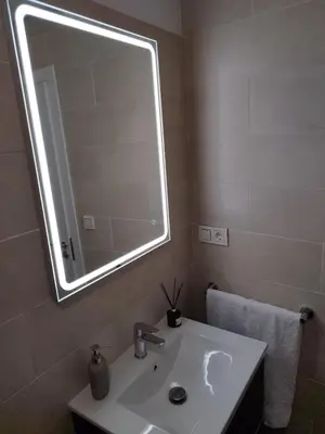 a bathroom with a sink and a large mirror at BALCON DEL EO in Ribadeo