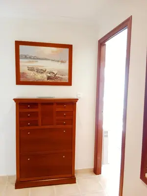 a room with a dresser and a picture on the wall at El Mirador 2 in Vivero