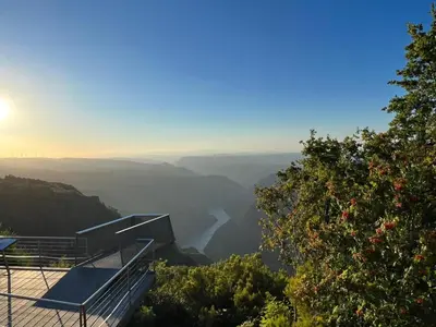 a house on a mountain overlooking a valley at Alojamiento Turístico Caxide Parada de Sil Ribeira Sacra in Parada del Sil