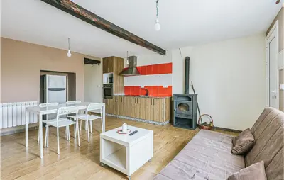 a living room with a couch and a table at 1 Bedroom Stunning Home In Galicia in Belesar