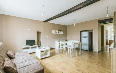 a living room with a couch and a table at 1 Bedroom Stunning Home In Galicia in Belesar