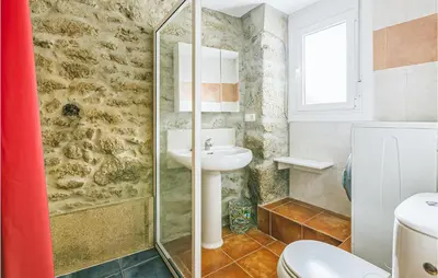 a bathroom with a sink and a shower at 1 Bedroom Stunning Home In Galicia in Belesar