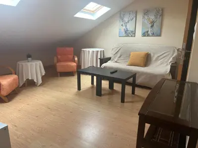 a living room with a couch and a table at Apartamento San Bartolo in Barreiros
