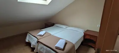 a bedroom with a bed with two towels on it at Apartamento San Bartolo in Barreiros