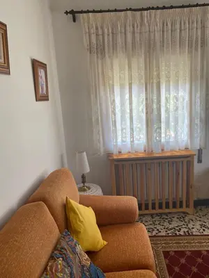 a living room with a couch and a window at Casa Roque in Monforte de Lemos