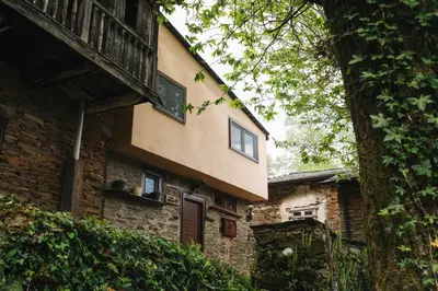 a building with a balcony on the side of it at CASA TRISQUEL in Hospital