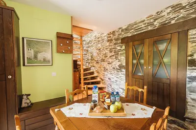 a dining room with a table with food on it at CASA TRISQUEL in Hospital