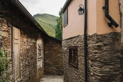 an alley in an old stone building with a street light at CASA TRISQUEL in Hospital