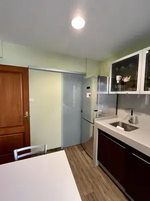 a kitchen with a sink and a refrigerator at Piso en pleno centro de Miño izquierda in Miño