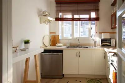 a small kitchen with a sink and a window at Bonito y luminoso apartamento en Rosalía de Castro in Santiago de Compostela