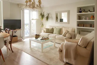 a living room with a couch and a table at Bonito y luminoso apartamento en Rosalía de Castro in Santiago de Compostela