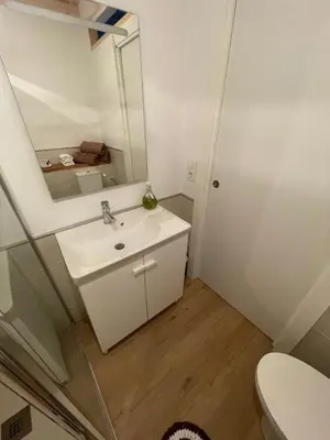 a bathroom with a sink and a mirror at As Fontaiñas in Beiro