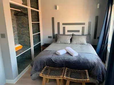 a bedroom with a bed with two towels on it at NOARU Apartamentos in Ares