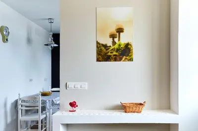 a room with a table and a picture on the wall at Casa Choureiro Apartamentos Rurales in Navia