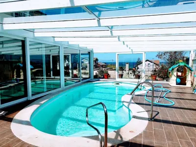 a swimming pool in a building with a pool at Casa Fina in Foz