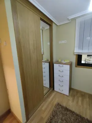 a bathroom with a large closet and a mirror at COSTA REINANTE SPA Y PISCINA in San Miguel de Reinante
