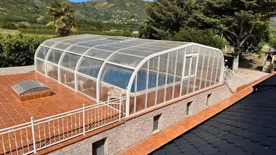 a glass house on top of a roof at VILLA DAVID in Horta