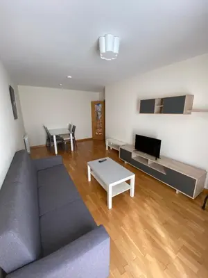a living room with a couch and a table at dpCristal Calvo Sotelo 164, 4D in Sarria