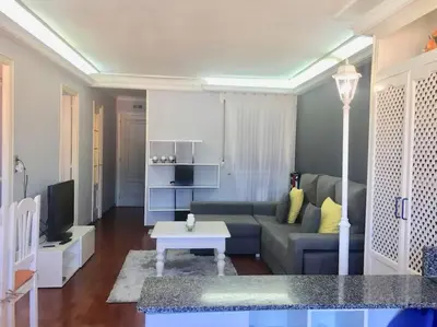 a living room with a couch and a table at Apartamento Lugo Centro in Lugo