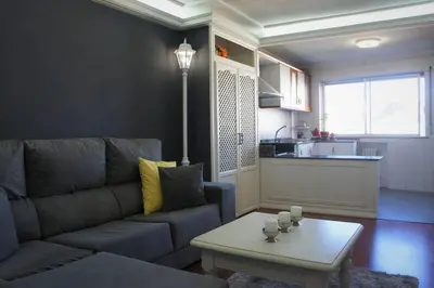 a living room with a couch and a coffee table at Apartamento Lugo Centro in Lugo
