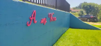 a blue wall with a sign that says krispy kreme at Casa A mi Vera in Covelo