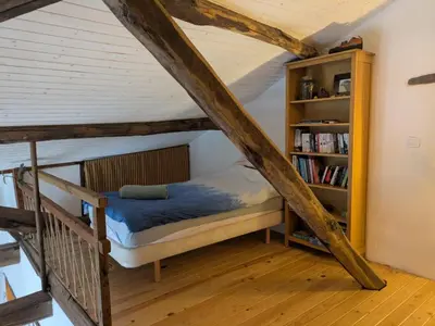 a bedroom with a bunk bed and a book shelf at Farm house in Ribeira Sacra in O Carballo
