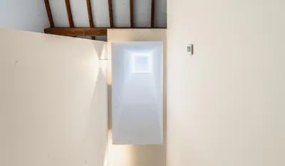 a white door in the middle of a room at O Souto da Aldea Ribeira Sacra Parada de Sil in Parada del Sil