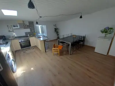 an aerial view of a living room and kitchen with a table at Casa da Eiriña in Amés