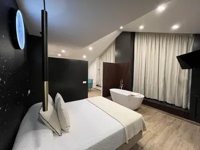 a bedroom with a bed and a television and lights at Casal de pelaio in Barreiros