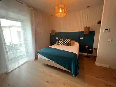 a bedroom with a bed and a large window at Casal de pelaio in Barreiros