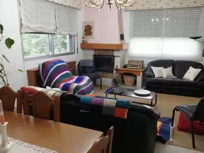a living room with two couches and a table at A CASA DOS AVÓS in Celanova