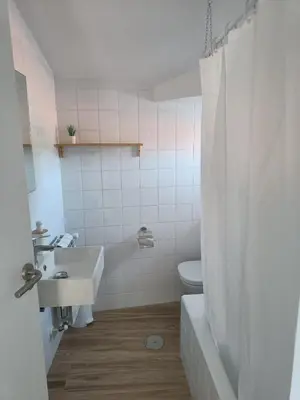 a white bathroom with a sink and a toilet at CASA A CALLE in O Pino