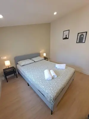 a bedroom with a bed with two pillows on it at Atico Porta de Santiago - Junto Catedral - VUT-LU-02906 in Lugo