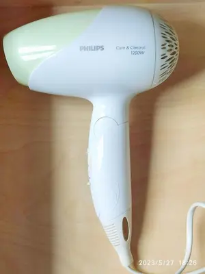 a white hair dryer sitting on top of a table at Casa de Ribeira Sacra in Pantón