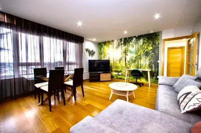 a living room with a couch and a table at Muralla & Views by Lugo Collection in Lugo