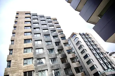 a tall building with many windows on it at Muralla & Views by Lugo Collection in Lugo