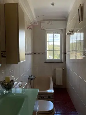 a bathroom with a tub and a toilet and a sink at Cabo de Veiga in Trabada