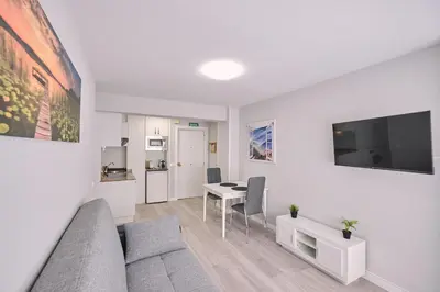 a living room with a couch and a table at La Casa de Julia Apartamento nuevo y céntrico in Santiago de Compostela