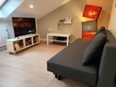 a living room with a couch and a tv at Catedral y Muralla a 50 metros - VUT-LU-02907 in Lugo