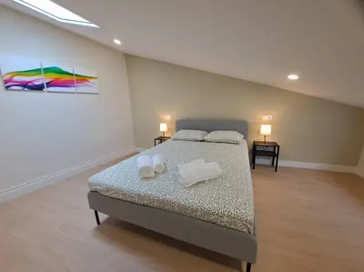a bedroom with a bed with two pillows on it at Catedral y Muralla a 50 metros - VUT-LU-02907 in Lugo