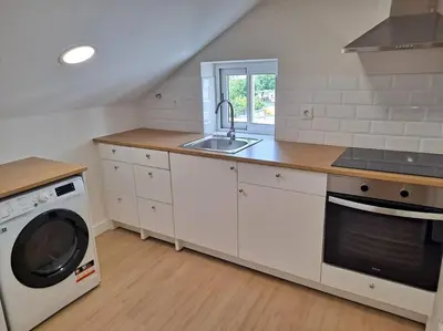 a kitchen with a sink and a washing machine at Catedral y Muralla a 50 metros - VUT-LU-02907 in Lugo