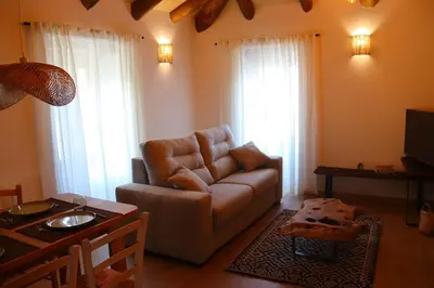a living room with a couch and a table at Casa Fente in Taboada